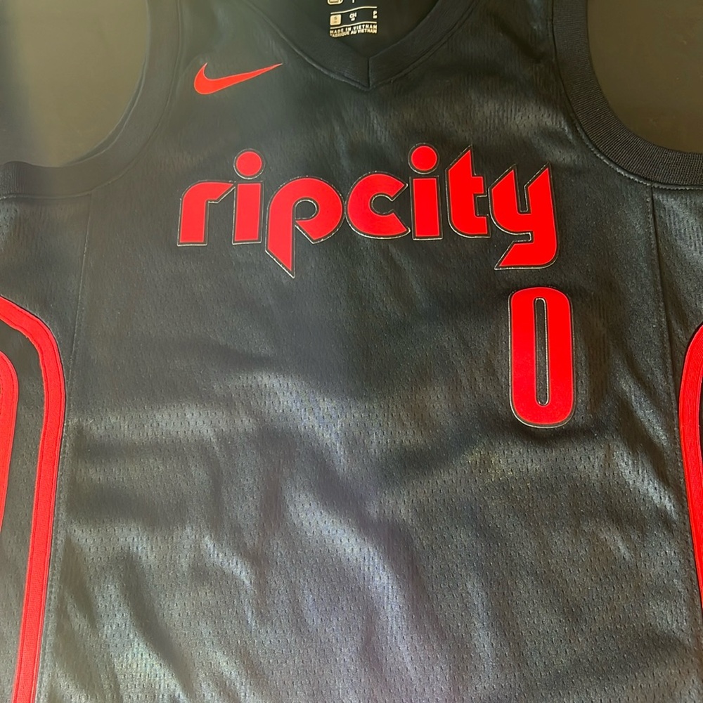 Plaid Damian Lillard jersey. Youth small.